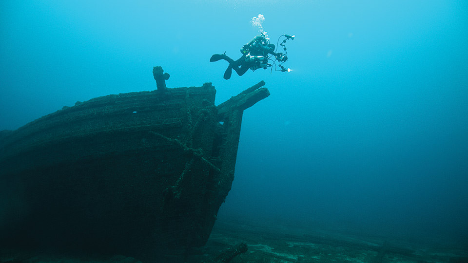 diver photographing a wreck in the Thunder Bay National Marine Sanctuary