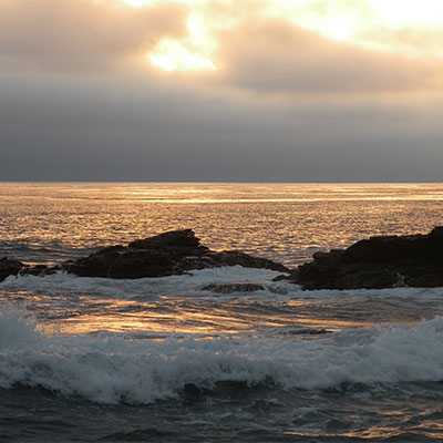 photo of a sunset over the beach in monterey bay