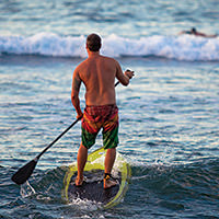 man on a paddleboard on the water