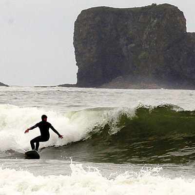 person surfing Olympic Coast NMS; Kate Thompson/NOAA;