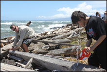 Students documenting shipwreck timbers along the shoreline during the 2009 project.  J Coney/NOAA ONMS 