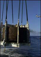 The Monitor s turret breaks the waters surface on August 5, 2002.