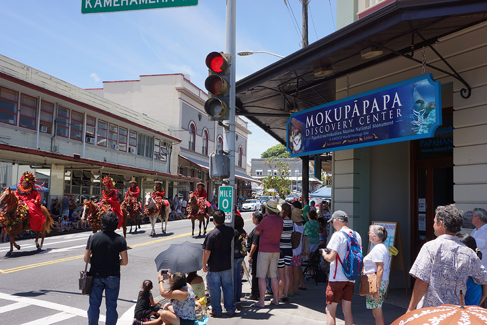 parade and festival-goers outside the mokupāpapa discovery center