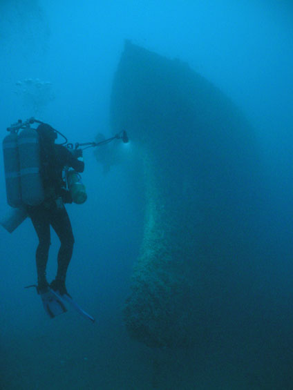A technical diver on a NOAA archaeological expedition photographs the distinctive ram bow of the Queen of Nassau