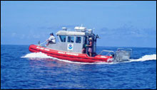 The research vessel Ahi operating in Kure atoll. Note the AC cabin to operate the computer equipment required for the sonar.