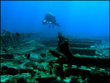 Maritime archaeologist Tane Casserley films the 
wreckage of a 3-masted sailing vessel wrecked at Kure Atoll
