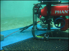 ROV testing cutting arm in pool.