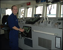 Alice Drury, Junior Officer, at the helm of the McArthur II