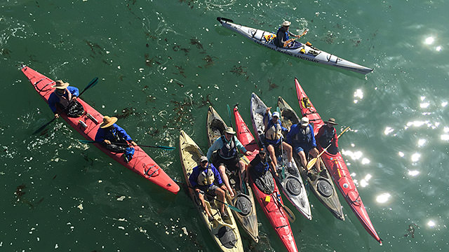 overhead shot of kayakers getting ready to kayak in monterey bay national marine sanctuary