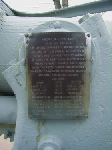 A plaque attached to the USS Ward gun listing the names of the gun crew