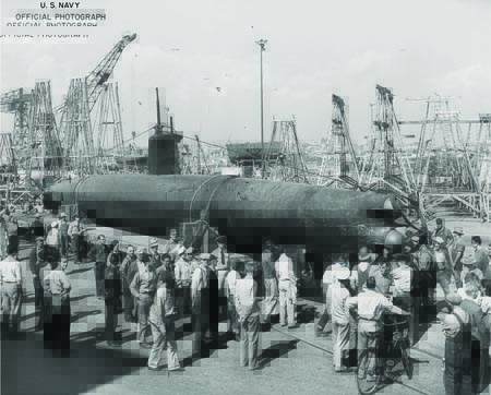 Midget submarine HA-19 surrounded by people as it is readied for its national war bond sales tour