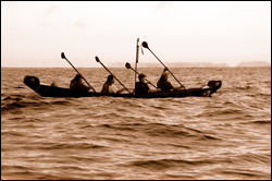 Chumash paddlers reenact the historic channel crossing in traditional plank canoes called tomols.