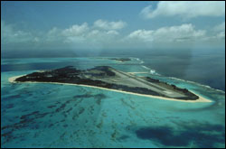 Figure 12. Sand (forefront) and Eastern Islands at Midway Atoll, the site of a U.S. naval air facility during the World War II and Cold War eras, before Midway was transferred to the U.S. Fish and Wildlife Service in 1996.