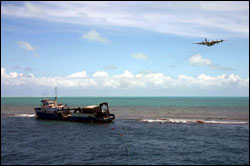 Figure 18. M/V Casitas aground at Pearl and Hermes Reef, July 2005.