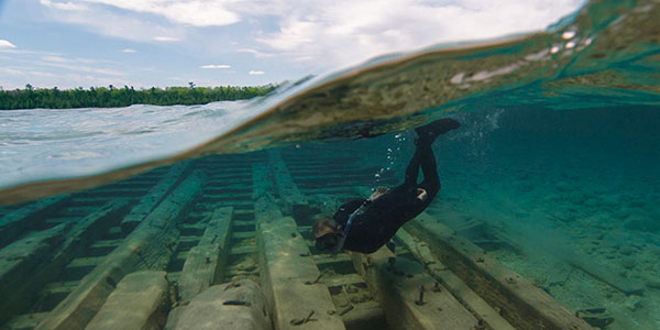 photo of diver and shipwreck