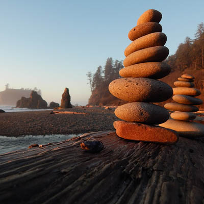 photo of rocks stacked on a beach
