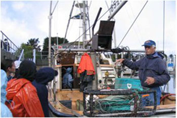 fishermen teaching students about fishing gear