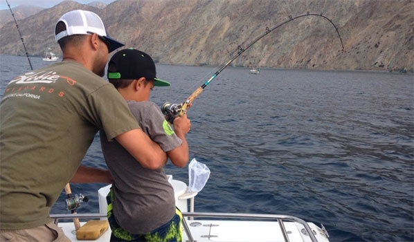 photo of father and son fishing