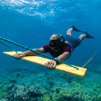 photo of a diver on a tugging line