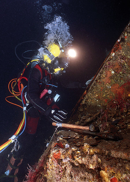 diver working on recovering the monitor cannon