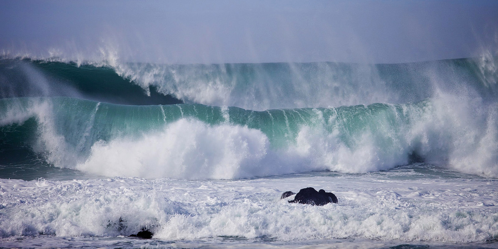 Waves crash on the shoreline of Monterey Bay National Marine Sanctuary