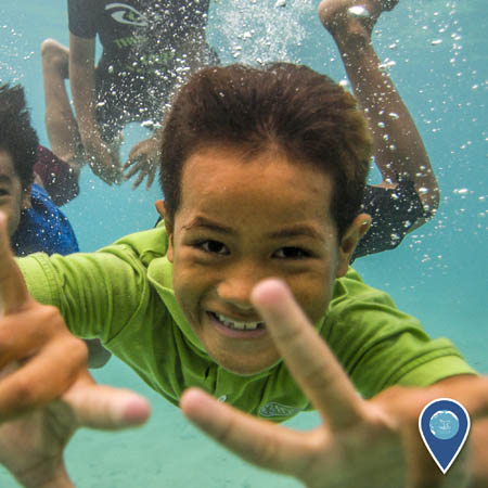 childern swimming in american samoa