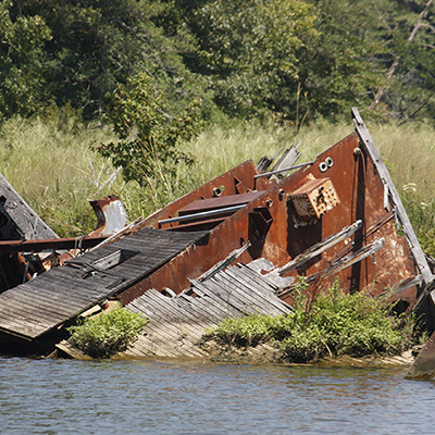 metal shipwreck above water