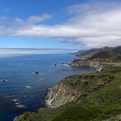 ocean with the cliffs of big sur at right