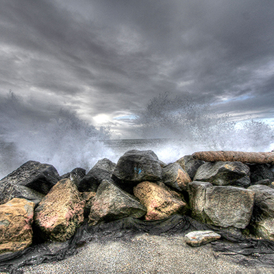waves breaking over rocks