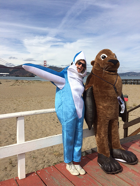 sanctuary sam mascot and a shark mascot
