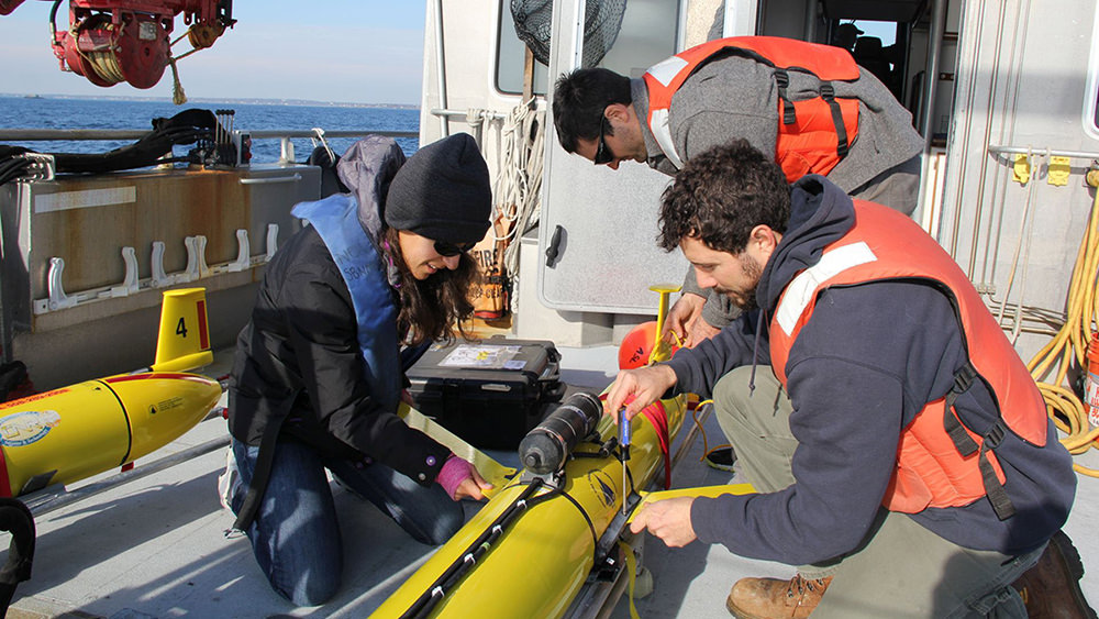 researchers deploying a glider