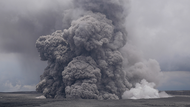 an ashy plume rises from kīlauea
