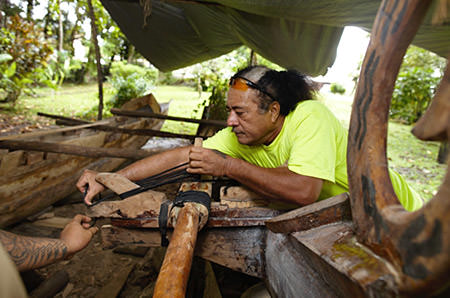 man building a traditional samoan canoe