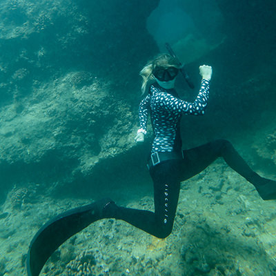 a freediver in a running pose