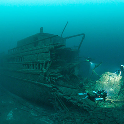 divers near a shipwreck