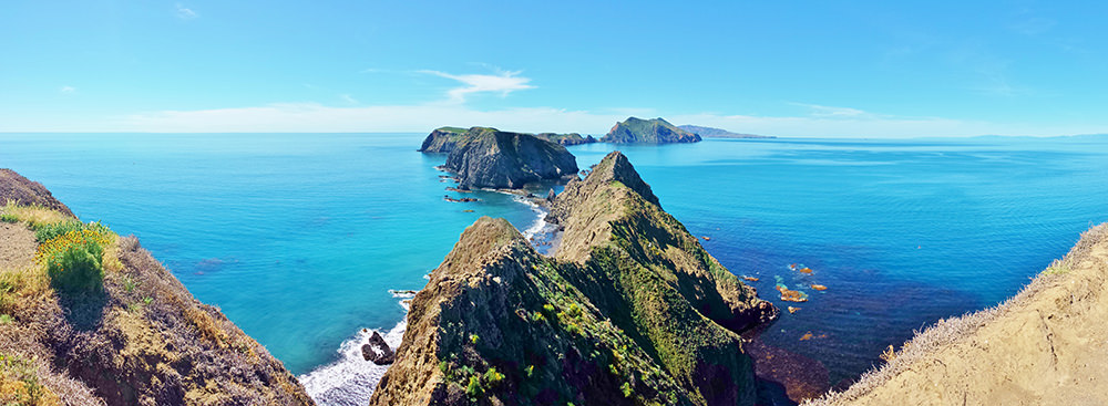 a view of anacapa island surrounded by ocean