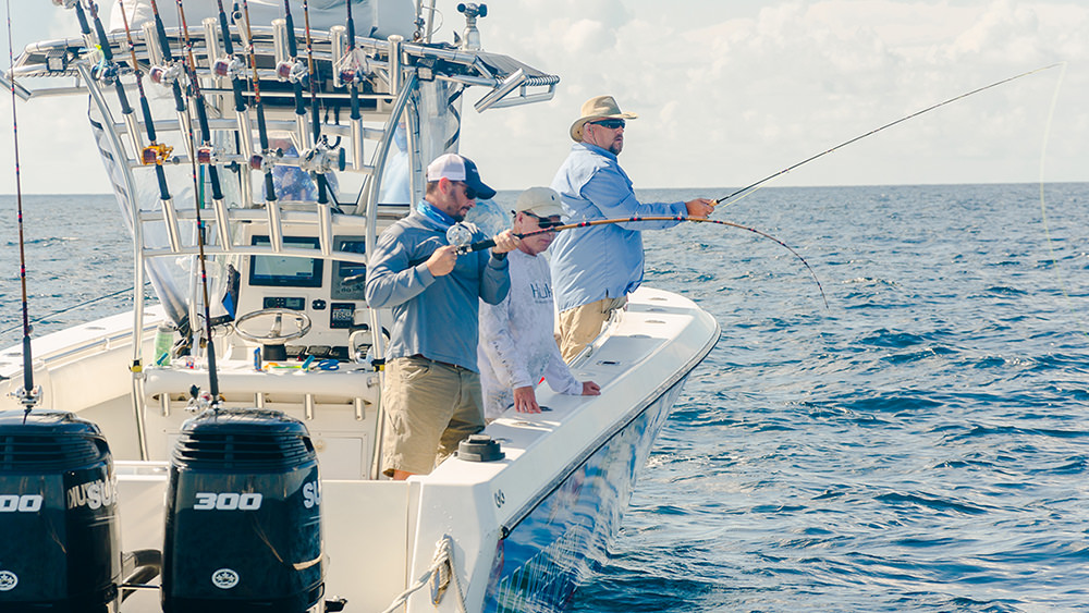 three anglers casting off a boat