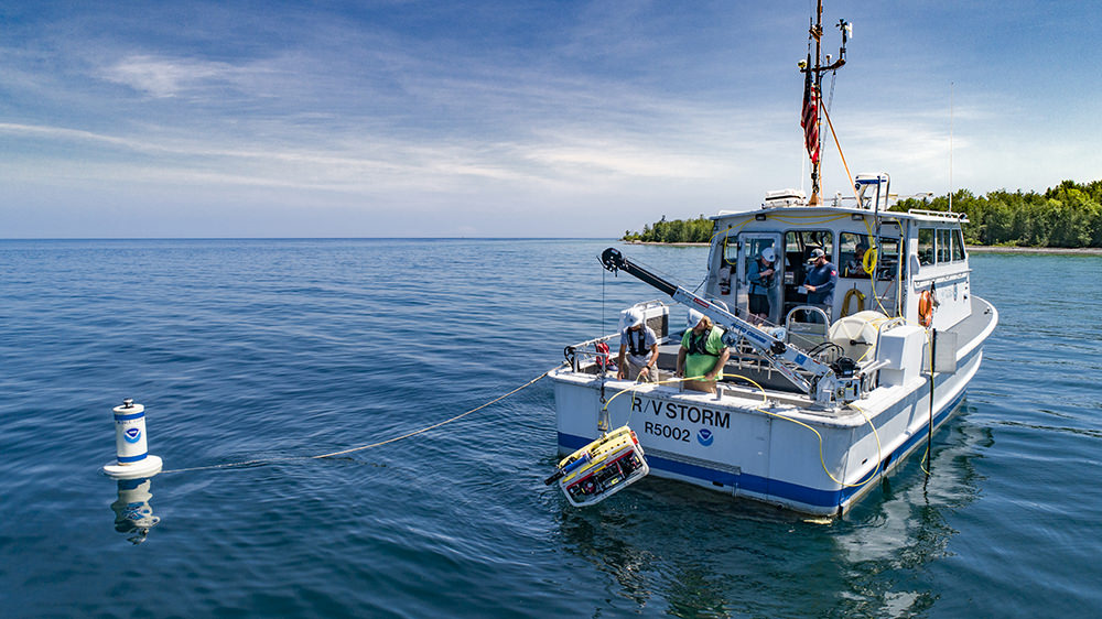 researchers on a boat in lake huron