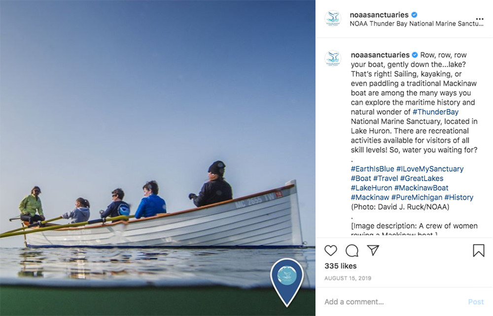 instagram post with a picture of people paddling a mackinaw boat