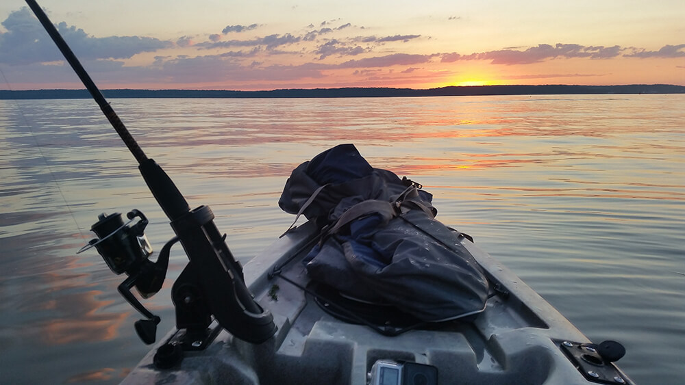 the view of a sunrise from a kayak