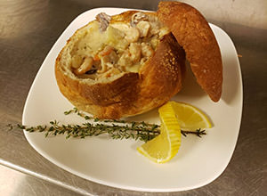 bread bowl filled with seafood chowder