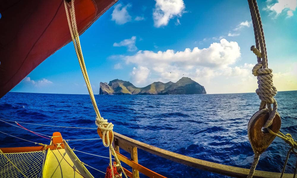 view of Nihoa island from a Polynesian voyaging canoe
