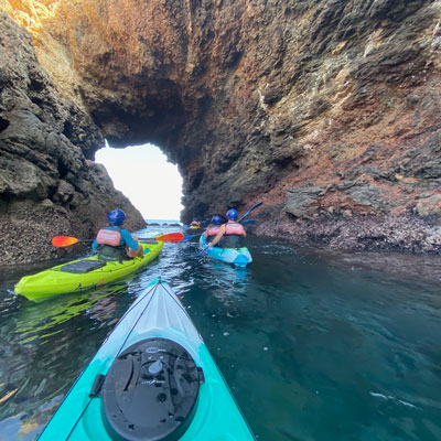 Kayakers under arch