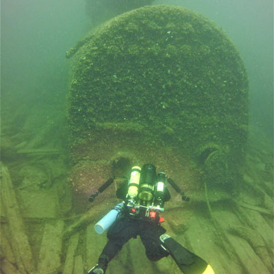 Diver in front of wreck