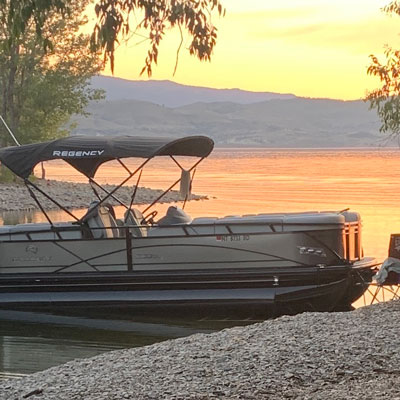 Sunset over lake with boat