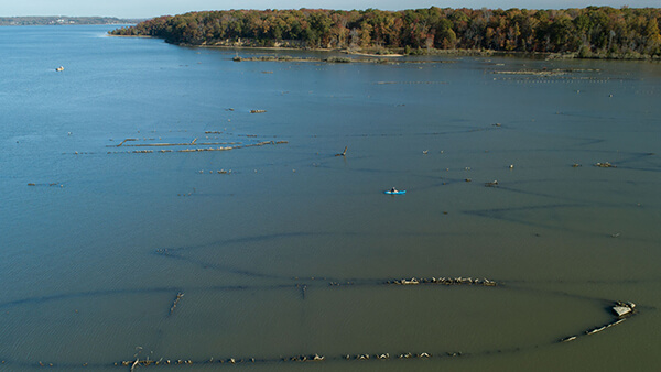 aerial view of kyakers padling near shipwrecks in mallows bay patomic river national marine sanctuary 