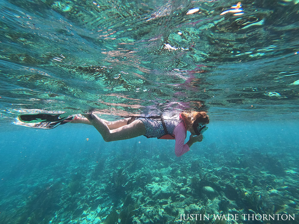 girl snorkeling, photo taken underwater