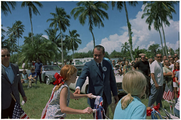 President Nixon surrounded by a large crowd