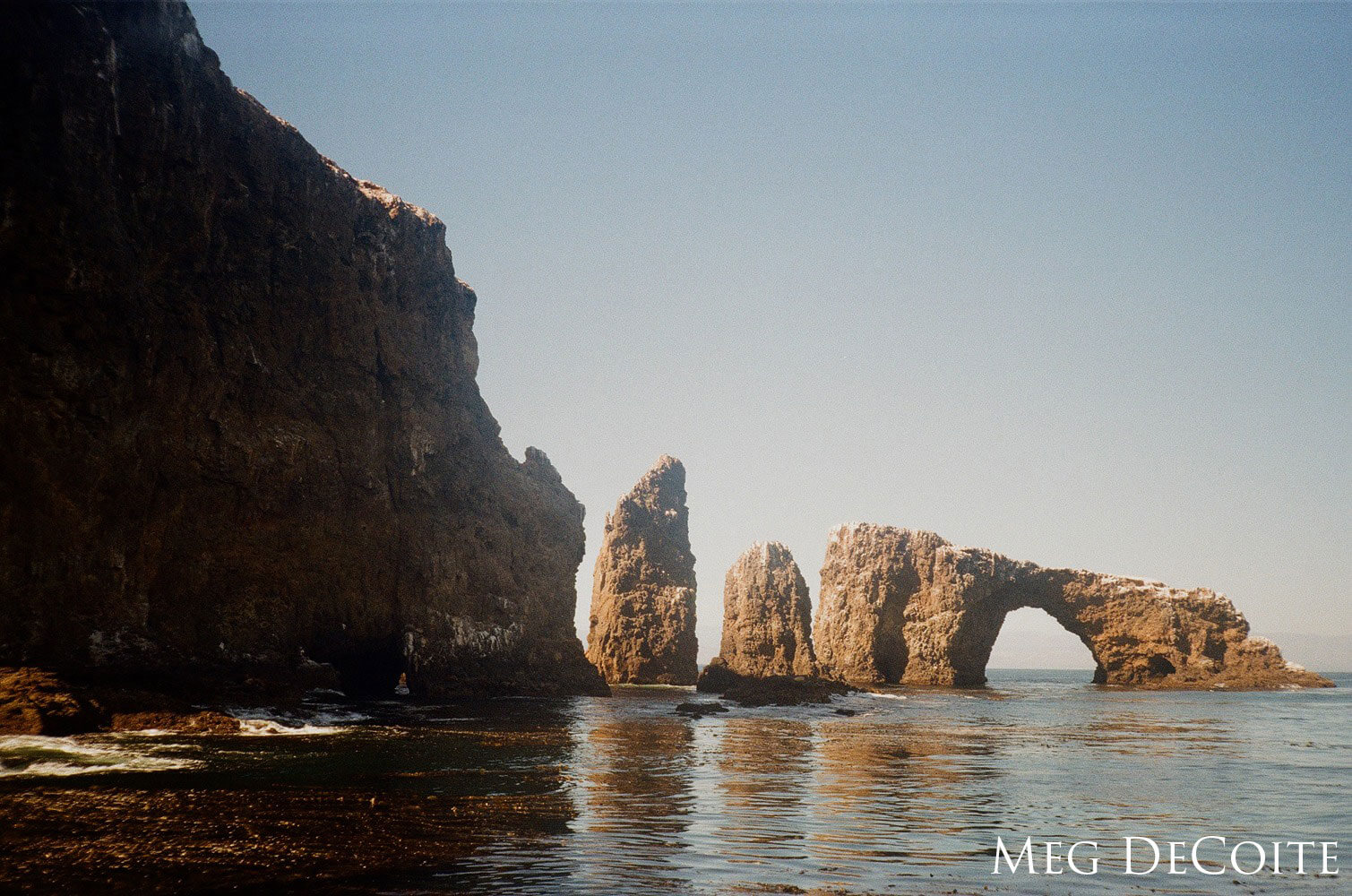 Rock arch in the water.