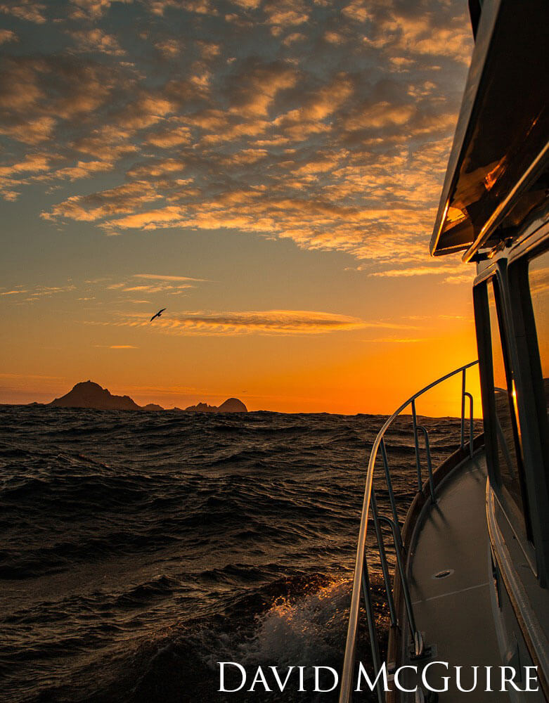 Island at sunset from a boat.